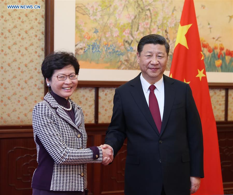 Chinese President Xi Jinping (R) meets with Lam Cheng Yuet-ngor, the newly appointed chief executive of the Hong Kong Special Administrative Region (HKSAR), in Beijing, capital of China, April 11, 2017. (Xinhua/Ju Peng)