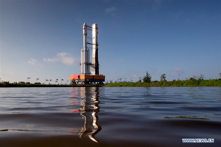 Photo taken on April 17, 2017 shows the cargo spacecraft Tianzhou-1 being transferred with a Long March-7 Y2 carrier rocket from the testing center to the launch zone in Wenchang, south China