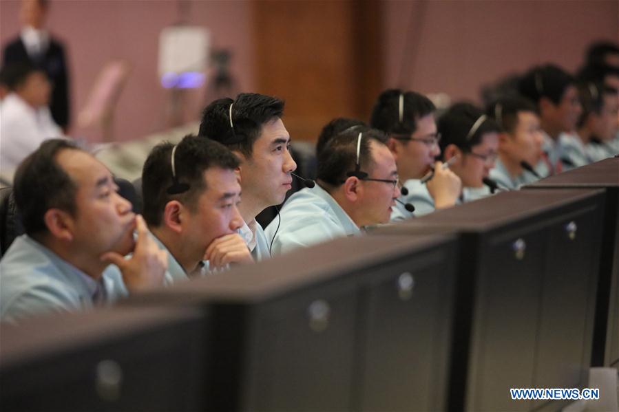 Technical personnel work at Beijing Aerospace Control Center to monitor the automated docking between Tianzhou-1 cargo spacecraft and Tiangong-2 space lab in Beijing, capital of China, April 22, 2017. The Tianzhou-1 cargo spacecraft, China