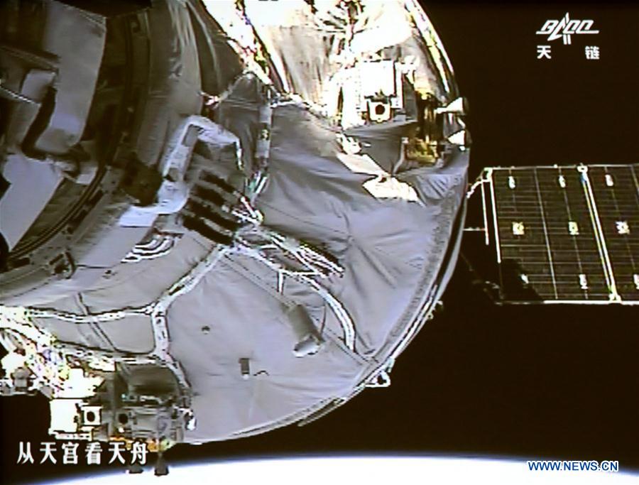 Photo taken on April 22, 2017 shows the Tianzhou-1 cargo spacecraft docking with the orbiting Tiangong-2 space lab on a screen at Beijing Aerospace Control Center in Beijing, capital of China. The Tianzhou-1 cargo spacecraft, China