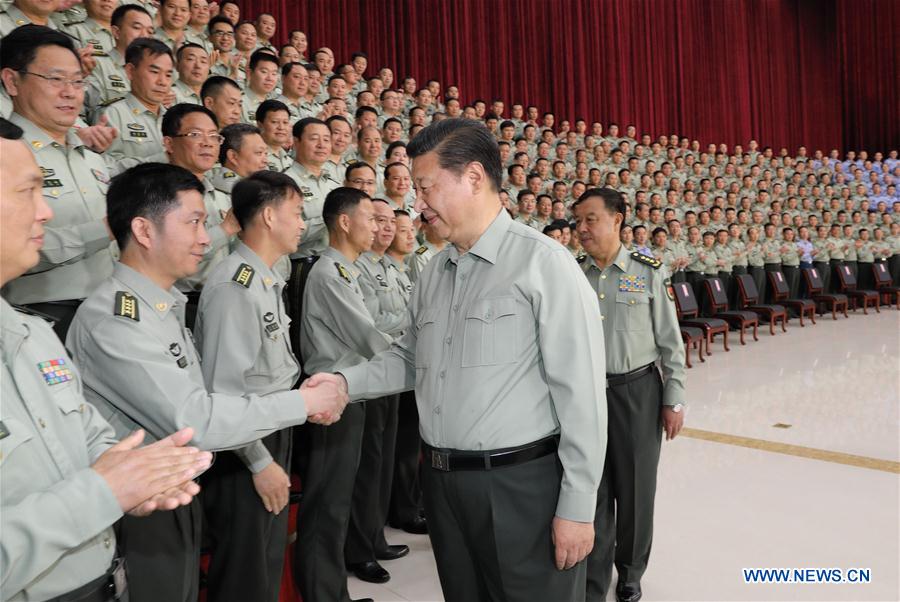 Chinese President Xi Jinping, who is also general secretary of the Communist Party of China (CPC) Central Committee and chairman of the Central Military Commission (CMC), meets with military officers during an inspection of the Southern Theater Command of the People