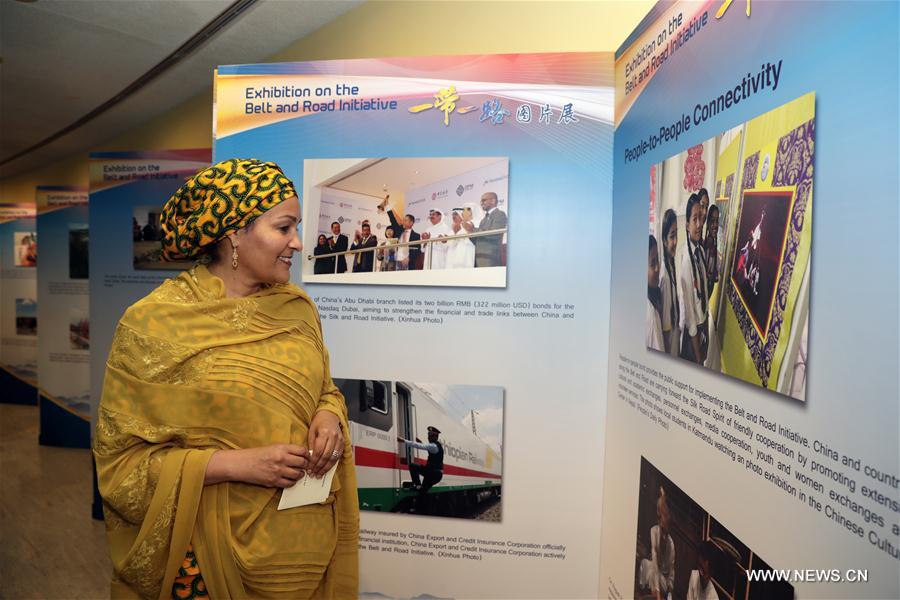 Amina Mohammed, United Nations deputy secretary-general, looks at photos during a photo exhibition on China