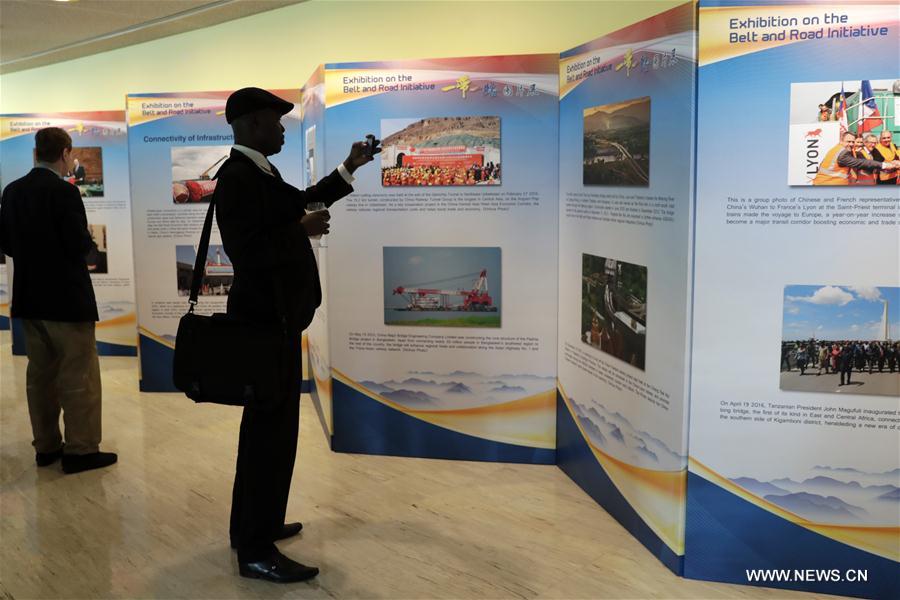 People visit a photo exhibition on China