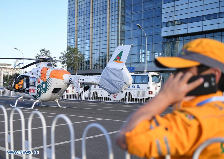 A helicopter for medical care is seen outside the China National Convention Center in Beijing, capital of China, May 13, 2017. The Belt and Road Forum (BRF) for International Cooperation will be held in Beijing from May 14 to 15. (Xinhua/Li He) 