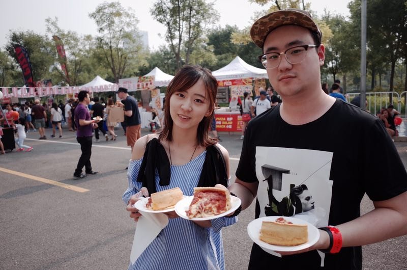 Attendees enjoying food. (Photo/ thebeijinger)