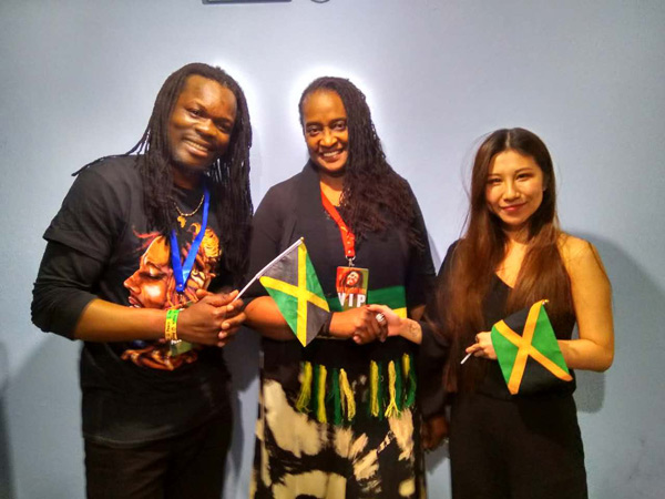 Cherett Campbell (center), Minister Counsellor at the Jamaican Embassy to the People&rsquo;s Republic of China, shares lens time with the lead female and male vocalists of the One Drop Band, Zhang Zichen from Hebei Province and Johnson Lufungulo from Zambia.  Photo provided by Vicki Cann