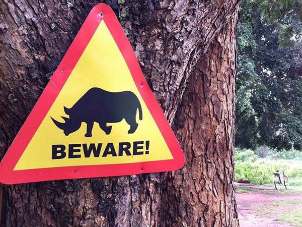 A public awareness notice to people visiting the park of Rhino crossing path ahead. (Photo/Timothy Sibasi)