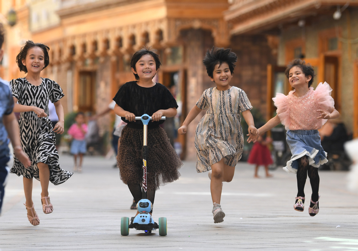 Children play in Dove Lane, in the old town of Tuancheng in Hotan, Xinjiang Uygur autonomous region.