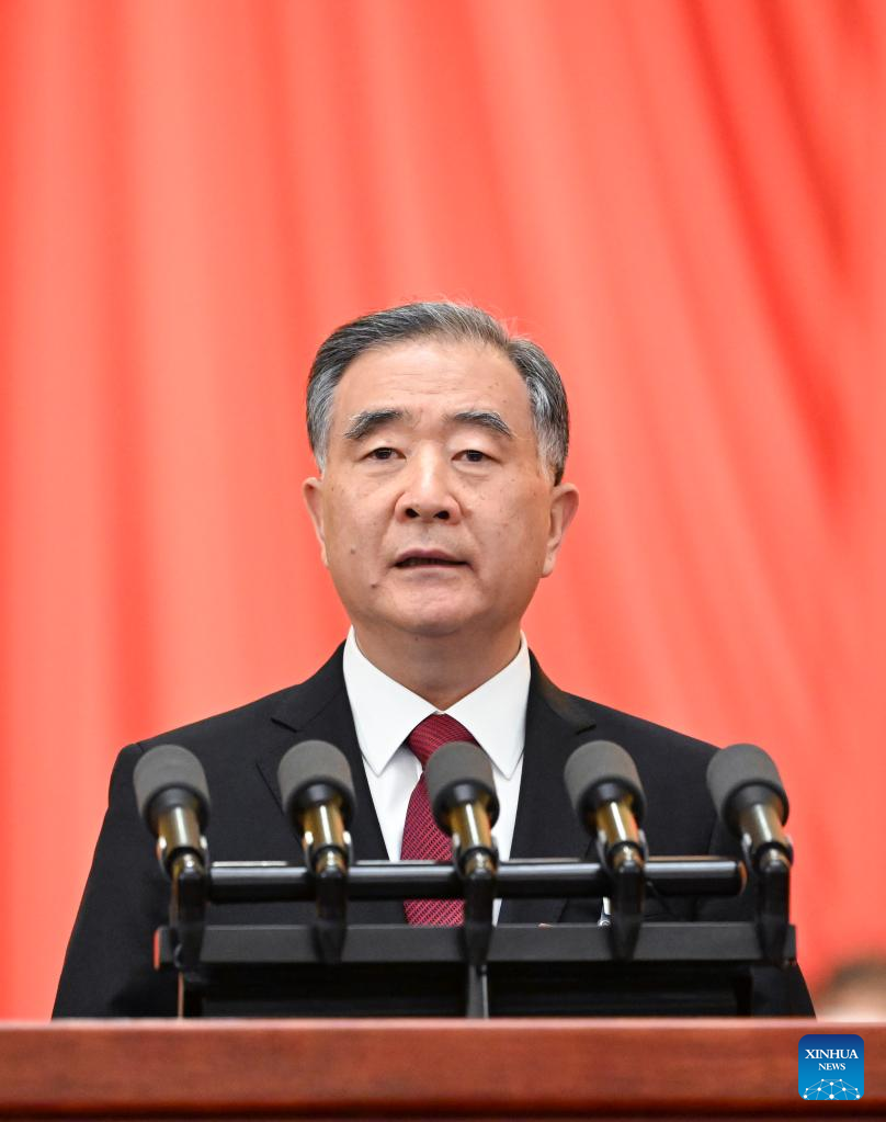 Wang Yang, chairman of the Chinese People’s Political Consultative Conference (CPPCC) National Committee, delivers a work report of the Standing Committee of the CPPCC National Committee at the opening meeting of the fifth session of the 13th CPPCC National Committee at the Great Hall of the People in Beijing, capital of China, March 4, 2022. (Xinhua/Rao Aimin)